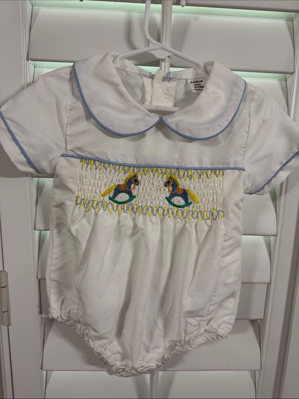 SHEIN White Baby One-Piece with Blue Trim and Rocking Horse Smocking